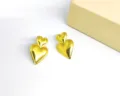Glossy gold double heart stud earrings trendy geometric metal jewelry for women daily wear - Double-Layered Heart Gold