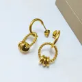 Elegant 18K gold plated twisted stainless steel hoop earrings with chic interlocking rings. - Multi-link Pendant Style / Gold