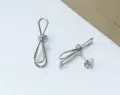 Silver loop knot stud earrings, modern minimalist metallic geometric ribbon design for daily wear. - Bowknot Shape / Silver