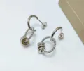Silver stainless steel twisted hoop earrings with geometric charm beads for women daily wear. - Beaded Pendant Style / Steel