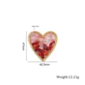 Close-up detail shot of heart-shaped stainless steel resin pendant showing precise dimensions. - Heart-Shaped Red Crushed Stones