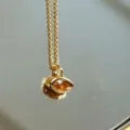 Gold-colored chain necklace featuring an amber marquise gemstone pendant for women fashion. - Orange Red