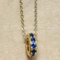 Chic copper alloy round wheel pendant necklace with blue stones, elegant minimalist jewelry. - Blue