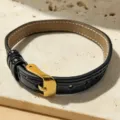 Black leather strap bracelet variant with gold buckle, minimalist vintage retro style accessory. - Bracelet Only / Black