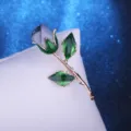 Blue fabric rose brooch with green enameled leaves and gold stem for party dress accessory SKU - Light Blue
