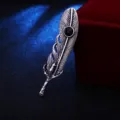 Vintage silver feather brooch detail view, unique eagle claw design with black inlaid stone. - Antique Silver