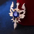 Broche vintage de espada de doble dragon con gran piedra preciosa azul para chaqueta traje. - Dorado