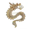 Exquisite gold dragon brooch detail, featuring sparkling rhinestones and a elegant pearl in mouth. - Gold