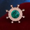 Elegant steering wheel brooch with sparkling green rhinestone, perfect for shirt collar decor. - Green