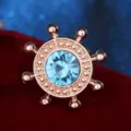 Gold tone ship wheel lapel pin with light blue rhinestone crystal brooch for shirt collar. - Lake Blue