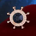 Exquisite ship helm collar pin with a dark blue rhinestone in rose gold tone metal. - Dark Blue