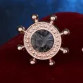 Rose gold ship helm brooch with dark grey rhinestone, elegant lapel pin for shirts and suits. - Gray