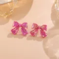 Charmante rosa schimmernde Schleifen Ohrstecker, süßer Acryl Ohrring Schmuck für Damen. - Schleife / 1 Paar Packung / Rosa
