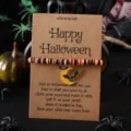 Halloween Wunscharmband mit orange schwarzen Tonperlen und Sichelmond Fledermaus Anhänger. - Sichelmond Fledermaus Stil 6