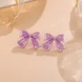 Glänzende lila Acryl Schleife Ohrringe, süßer Stil Variante für den täglichen Gebrauch. - Schleife / 1 Paar Packung / Lila