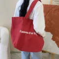 Red canvas tote bag with Famous For Pizza print, spacious casual shoulder bag for daily use. - Dark Red