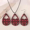 Close-up detail of the red and black plaid wooden heart earrings and necklace set. - Red and Black Plaid Heart Style