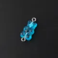 Blue resin gummy bear charm with double loops, perfect for DIY jewelry making and crafts. - Glitter Bear (AP2603) / 10 Pieces/Pack / Light Blue