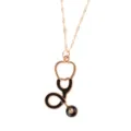 Gold alloy stethoscope pendant necklace with black enamel detail, elegant medical theme jewelry. - Black Stethoscope Nurse Series Style