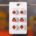 Autumn Thanksgiving wooden stud earrings set featuring pumpkin and maple leaf designs. - Thanksgiving Stud Earrings Three Pair Set (SHE3342)