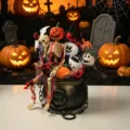 Halloween skeleton bouquet in cauldron, spooky table decor, gothic floral arrangement with plush ghosts. - Bouquet Bucket Two (Z351)