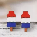 Detailed shot of patriotic red white and blue wooden popsicle stud earrings for women. - Retro Tricolor Stripe Popsicle Style (SHE741)