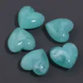 Turquoise acrylic heart beads close-up detail showcasing faux jade marbled texture for DIY jewelry. - Mint Green