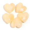 Close-up details of heart-shaped acrylic beads with marbled texture, ideal for DIY crafts. - Off White