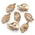 Beige acrylic gold rimmed seashell charms for DIY necklace and bracelet jewelry making parts. - 10 Pieces/Pack (Outer Diameter Approx 18X30mm)