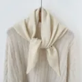 Chic knit wool blend triangular scarf detail shot, warm autumn winter fashion neck wrap. - Beige
