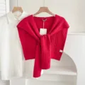 Red knit sweater shawl detail view, stylish women layering accessory with cable knit design. - Twist - Red