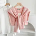Pink knit shawl detail shot, stylish twisted cable knit scarf layered with white shirt for women. - Twist - Soft Pink