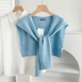 Blue cable knit shawl cape paired with white shirt, stylish layered sweater accessory for women. - Cable Knit - Sky Blue
