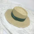 Details of a classic women's flat top straw hat with a stylish green ribbon, summer sun hat. - M (56-58cm) / Beige with Green Ribbon