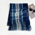 Detailed view of winter blue plaid scarf with stylish tassels, cozy knit fabric and warm design. - 200x70cm - 280g / Blue Lines
