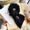 Black knitted wool scarf featuring cute embroidered bear design, perfect winter cozy accessory. - 160x25cm / Black