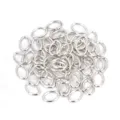 Detail view of silver metal oval jump rings for DIY jewelry making and crafting projects. - 200 Pieces/Pack (7*5mm) / Silver