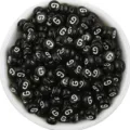 Detail view of black acrylic flat round letter beads with white letter G in white bowl for DIY. - Letter G / 100 Pieces Set