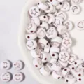 Acrylic flat round beads with cute star heart moon patterns for DIY jewelry making. - 100 Pieces Per Pack (Approx Diameter 7mm) / White Base with Rose Gold Patterns