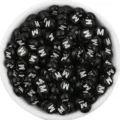 Close-up detail of black acrylic flat round letter beads with white M print for DIY jewelry. - Letter M / 100 Pieces Set