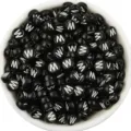 Detailed close up of black acrylic round alphabet letter beads with white print for DIY jewelry. - Letter W / 100 Pieces Set