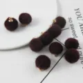 Burgundy fluffy pom pom charms with gold loops, ideal for DIY handmade earrings and jewelry making. - Single Pack / Burgundy