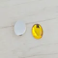 DIY acrylic flatback gemstone detail showing smooth oval shape and vibrant yellow finish. - 22*30mm / Gold Yellow