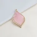 Close up view of a DIY handmade jewelry pink thread woven leaf charm pendant detail showcase. - Pink