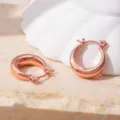 Close-up detail of stylish minimalist 18k rose gold plated chunky hoop earrings for women. - Rose Gold