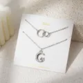 Dubbellaagse zilveren ketting set met maan ster hanger en ineinander grijpende cirkels. - Dubbellaagse Maan Ster Stijl