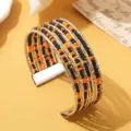Boho meerlagen manchetarmband met gemengde zwarte en oranje kralen en zilveren metaal. - Tweekleurig 15 / Zilver