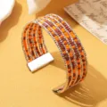Boheemse meerlagige kralen armband met gemengde oranje bruine kralen en metalen strengen. - Tweekleurig 13 / Zilver