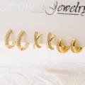 Gedetailleerd overzicht van 18k vergulde micro-pave zirconia kraakbeen oorbellen set. - Set 4 (A-004) / Goud