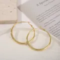 Klassieke grote gouden creolen voor dames, minimalistische gepolijste statementsieraden. - 50mm / Goud